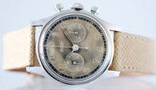 Load image into Gallery viewer, Tissot, Ref. No. 6216-3. Made in the 1950s and sold by Galli Uhren in Zürich, Switzerland. Fine, water resistant, stainless radium dial steel wristwatch with round button chronograph, registers.