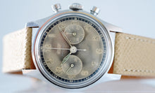 Load image into Gallery viewer, Tissot, Ref. No. 6216-3. Made in the 1950s and sold by Galli Uhren in Zürich, Switzerland. Fine, water resistant, stainless radium dial steel wristwatch with round button chronograph, registers.