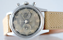 Load image into Gallery viewer, Tissot, Ref. No. 6216-3. Made in the 1950s and sold by Galli Uhren in Zürich, Switzerland. Fine, water resistant, stainless radium dial steel wristwatch with round button chronograph, registers.