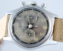 Load image into Gallery viewer, Tissot, Ref. No. 6216-3. Made in the 1950s and sold by Galli Uhren in Zürich, Switzerland. Fine, water resistant, stainless radium dial steel wristwatch with round button chronograph, registers.
