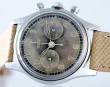 Load image into Gallery viewer, Tissot, Ref. No. 6216-3. Made in the 1950s and sold by Galli Uhren in Zürich, Switzerland. Fine, water resistant, stainless radium dial steel wristwatch with round button chronograph, registers.
