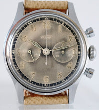 Load image into Gallery viewer, Tissot, Ref. No. 6216-3. Made in the 1950s and sold by Galli Uhren in Zürich, Switzerland. Fine, water resistant, stainless radium dial steel wristwatch with round button chronograph, registers.
