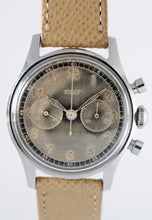 Load image into Gallery viewer, Tissot, Ref. No. 6216-3. Made in the 1950s and sold by Galli Uhren in Zürich, Switzerland.  Fine, water resistant, stainless radium dial steel wristwatch with round button chronograph, registers.
