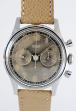 Load image into Gallery viewer, Tissot, Ref. No. 6216-3. Made in the 1950s and sold by Galli Uhren in Zürich, Switzerland. Fine, water resistant, stainless radium dial steel wristwatch with round button chronograph, registers.