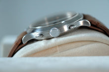 Load image into Gallery viewer, A very large stainless steel double pusher chronograph from Eberhard Case. Three-body, polished, stepped flat bezel, concave lugs, flat band, hinged snap-on case back.