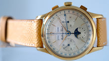 Load image into Gallery viewer, Mathey-Tissot, Triple Calendar Chronograph, Made in the 1970s. Fine, manual-winding, 18 karat yellow gold wristwatch with square button chronograph, registers, triple date and moon phases.