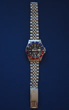 Load image into Gallery viewer, Rolex, Oyster Perpetual, GMT Master, Superlative Chronometer, Officially Certified, Ref. 1675. Made in Switzerland . Fine, two time zone, center seconds, self-winding, water-resistant, stainless steel wristwatch with date, 24-hour bezel and hand and a stainless steel Rolex riveted bracelet.