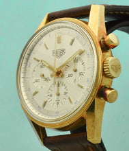 Load image into Gallery viewer, Heuer Chronograph, "Carrera, 1964 re-edition", No. 1119, Ref. CS3140 in yellow gold. Made in a numbered series circa 1996. Two-tone silver with applied yellow gold faceted baton indexes and luminous dots, outer minutes and 1/5th seconds track, inner scale for conversion of time into 100 fractions per minute, subsidiary dials for the seconds, the 30-minute and 12-hour registers. Luminous yellow gold baton hands.
