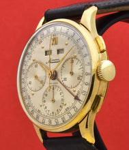 Load image into Gallery viewer, Minerva, triple calendar chronograph, made circa 1955. Dial: Brushed silver with applied Roman numeral at 12 and gold markers, outer minutes and 1/5th seconds track, subsidiary dials for the seconds, the 12-hour and 30-minute registers, apertures for the days of the week and months in French. Thin hands. Signed Minerva.