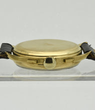 Load image into Gallery viewer, Minerva, triple calendar chronograph, made circa 1955.Minerva, triple calendar chronograph, made circa 1955. Case: 18 karat Gold, three-body, polished and brushed, concave lugs, inclined bezel, snap-on case back, signed Minerva.