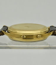 Load image into Gallery viewer, Minerva, triple calendar chronograph, made circa 1955.Minerva, triple calendar chronograph, made circa 1955. Case: 18 karat Gold, three-body, polished and brushed, concave lugs, inclined bezel, snap-on case back, signed Minerva.