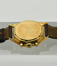 Load image into Gallery viewer, Heuer Chronograph, "Carrera, 1964 re-edition", No. 1119, Ref. CS3140 in yellow gold. Made in a numbered series circa 1996. 18 karat yellow gold, two-body, polished and brushed, flat bezel, lapidated lugs, screwed-down case back. Original signed 18 karat yellow gold buckle signed Heuer