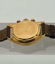Load image into Gallery viewer, Heuer Chronograph, "Carrera, 1964 re-edition", No. 1119, Ref. CS3140 in yellow gold. Made in a numbered series circa 1996. 18 karat yellow gold, two-body, polished and brushed, flat bezel, lapidated lugs, screwed-down case back. Original signed 18 karat yellow gold buckle signed Heuer