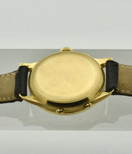 Load image into Gallery viewer, Minerva, triple calendar chronograph, made circa 1955. Case: 18 karat Gold, three-body, polished and brushed, concave lugs, inclined bezel, snap-on case back, signed Minerva.