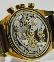 Load image into Gallery viewer, Heuer Chronograph, "Carrera, 1964 re-edition", No. 1119, Ref. CS3140 in yellow gold. Made in a numbered series circa 1996. Cal. Lemania 1873, rhodium-plated, 18 jewels, straight-line lever escapement, monometallic balance, shock absorber, self-compensating flat balance spring, index regulator.