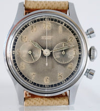 Load image into Gallery viewer, Tissot, Ref. No. 6216-3. Made in the 1950s and sold by Galli Uhren in Zürich, Switzerland.  Fine, water resistant, stainless radium dial steel wristwatch with round button chronograph, registers.
