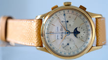 Load image into Gallery viewer, Mathey-Tissot, Triple Calendar Chronograph, Made in the 1970s. Fine, manual-winding, 18 karat yellow gold wristwatch with square button chronograph, registers,  triple date and moon phases.
