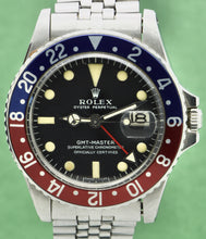 Load image into Gallery viewer, Rolex, Oyster Perpetual, GMT Master, Superlative Chronometer, Officially Certified,  Ref. 1675. Made in Switzerland . Fine, two time zone, center seconds, self-winding, water-resistant, stainless steel wristwatch with date, 24-hour bezel and hand and a stainless steel Rolex riveted bracelet.
