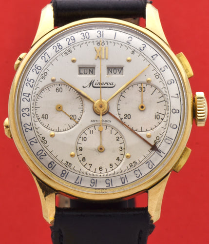 Minerva, triple calendar chronograph, made circa 1955. Dial: Brushed silver with applied Roman numeral at 12 and gold markers, outer minutes and 1/5th seconds track, subsidiary dials for the seconds, the 12-hour and 30-minute registers, apertures for the days of the week and months in French. Thin hands. Signed Minerva.