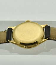 Load image into Gallery viewer, Minerva, triple calendar chronograph, made circa 1955. Case:  18 karat Gold, three-body, polished and brushed, concave lugs, inclined bezel, snap-on case back, signed Minerva.
