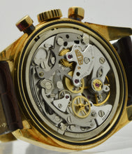 Load image into Gallery viewer, Heuer Chronograph, &quot;Carrera, 1964 re-edition&quot;, No. 1119, Ref. CS3140 in yellow gold. Made in a numbered series circa 1996. Cal. Lemania 1873, rhodium-plated, 18 jewels, straight-line lever escapement, monometallic balance, shock absorber, self-compensating flat balance spring, index regulator.
